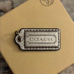 Coach Metallic Silver hang tag